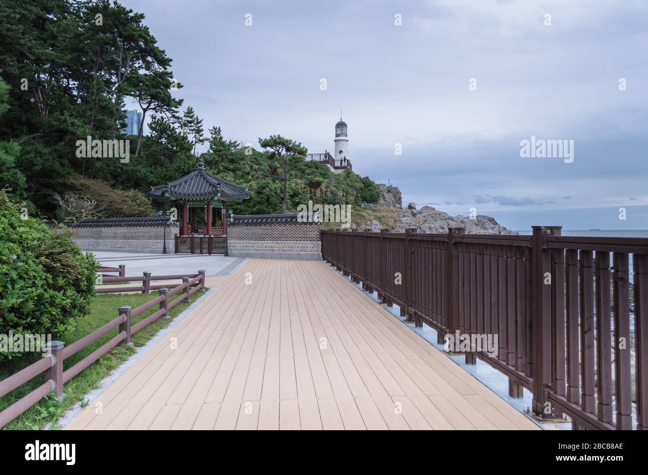 Dongbaek lighthouse view from below part of Naru park on gloomy day Stock Photo