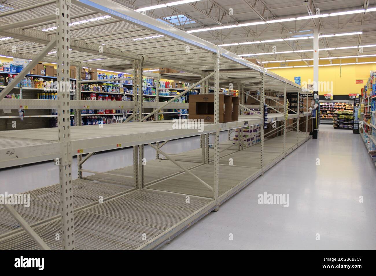 Walmart Super store empty Toilet Paper,Paper towels, and Wipes Isle with metal shelves completely EMPTY during the Corona Virus Pandemic. Stock Photo