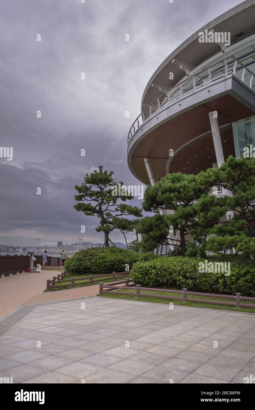 part of Nurimaru APEC House and its grounds on gloomy day with cloudy skies Stock Photo