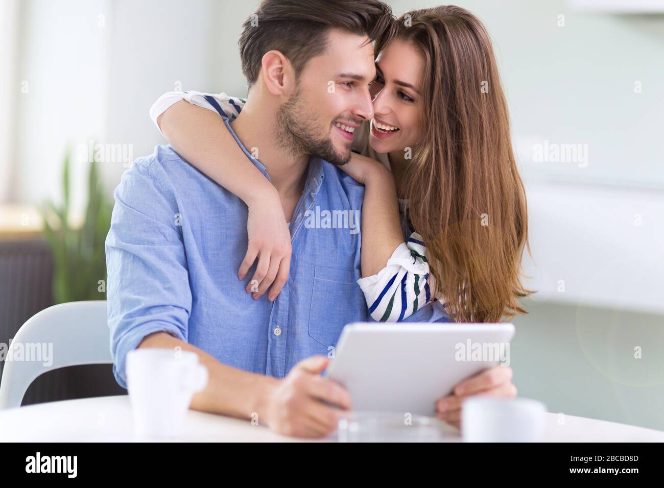 Couple using laptop together Stock Photo