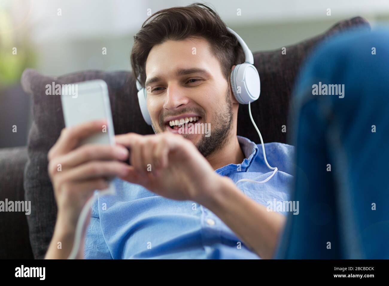 Young man enjoying music Stock Photo