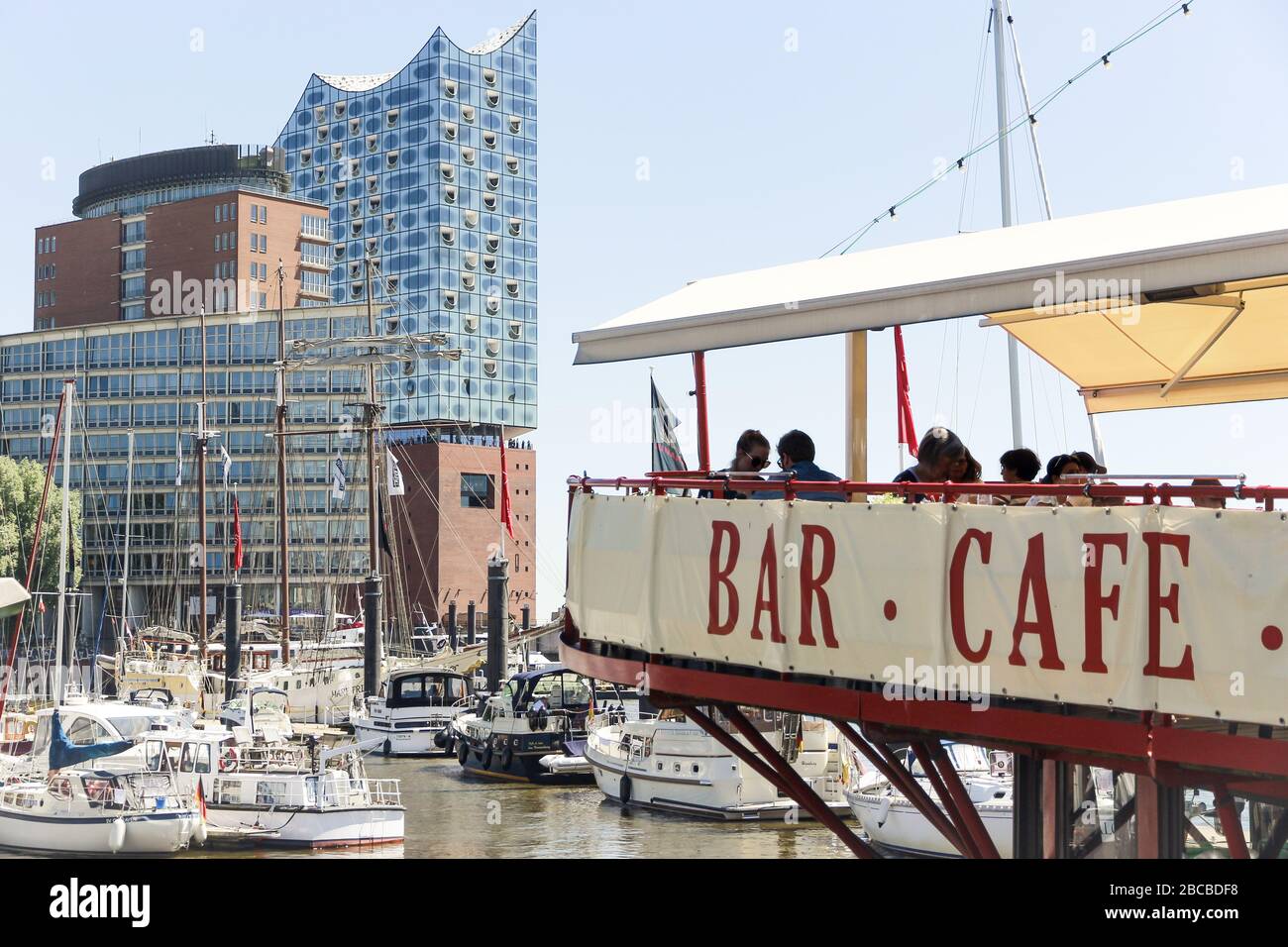The Elbphilharmonie in Hamburg with the terrace of a restaurant boat in the foreground Stock Photo