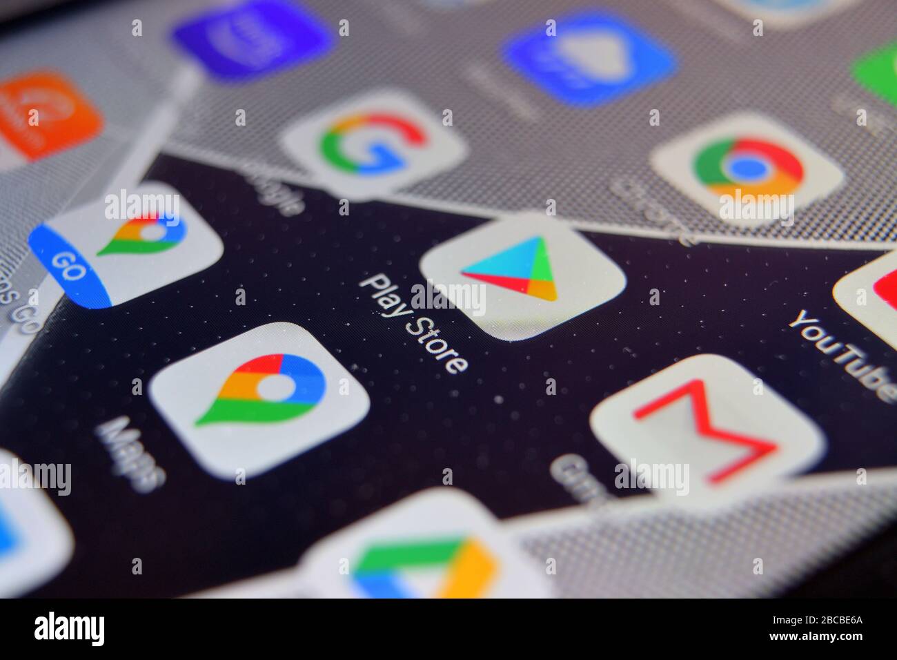 Valverde (CT), Italy - April 02, 2020: Close-up view of Google Play Store app on an Android smartphone, including other icons. Stock Photo