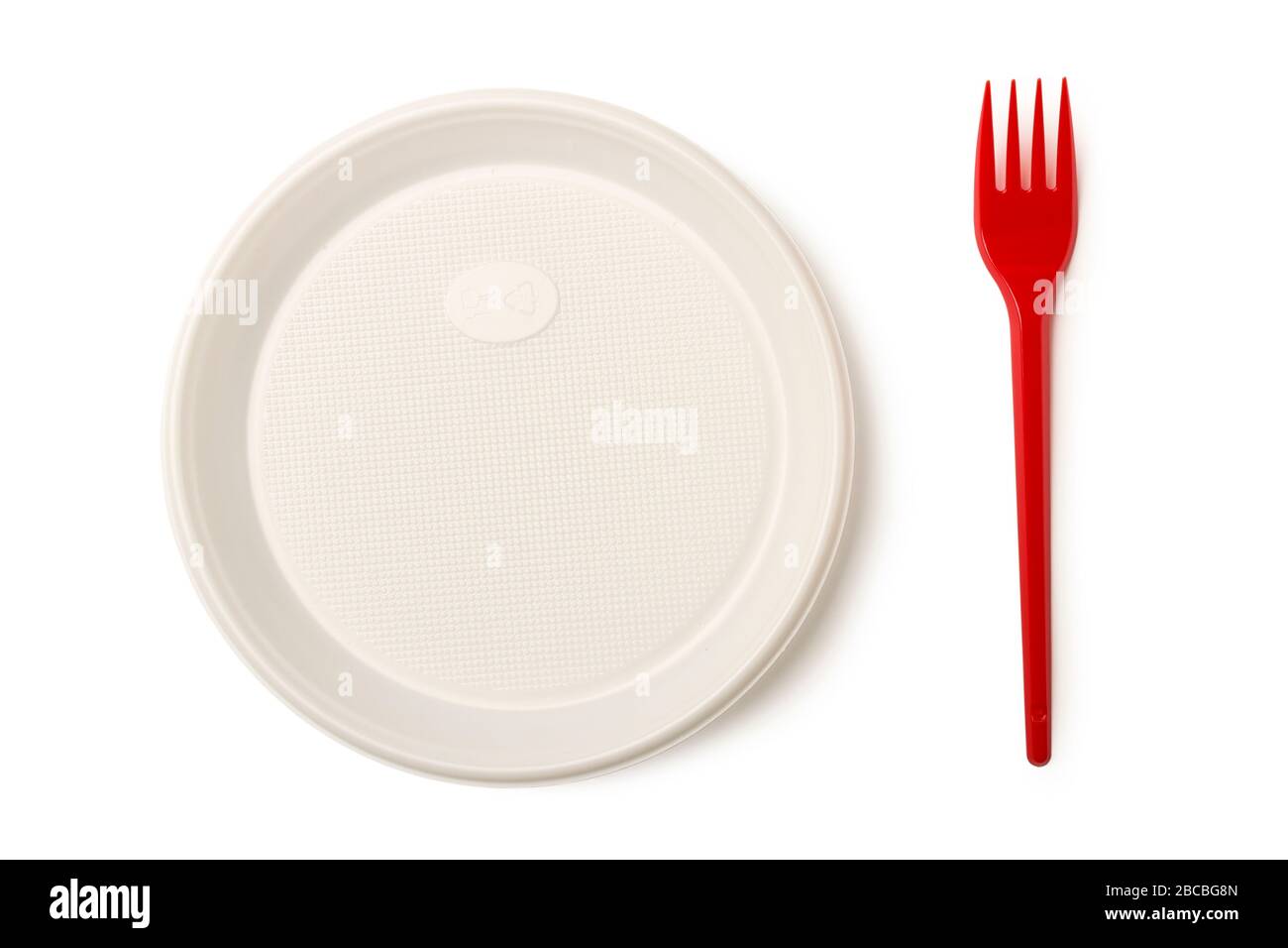 Disposable plastic plate and red plastic fork isolated on white background Stock Photo