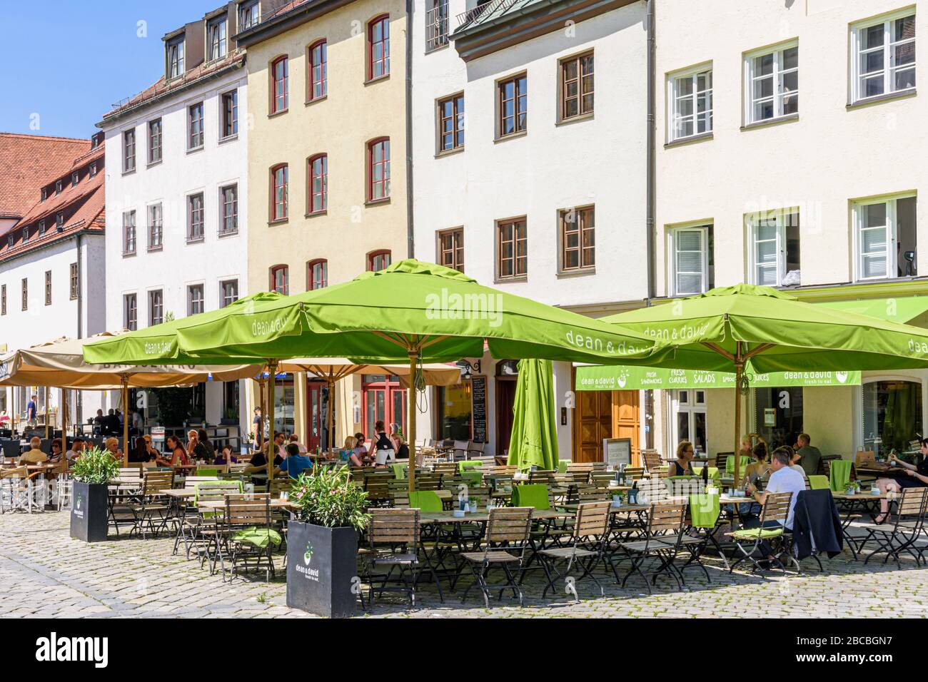 Cafes and restaurants outdoor tables in the old town of Munich, Germany Stock Photo
