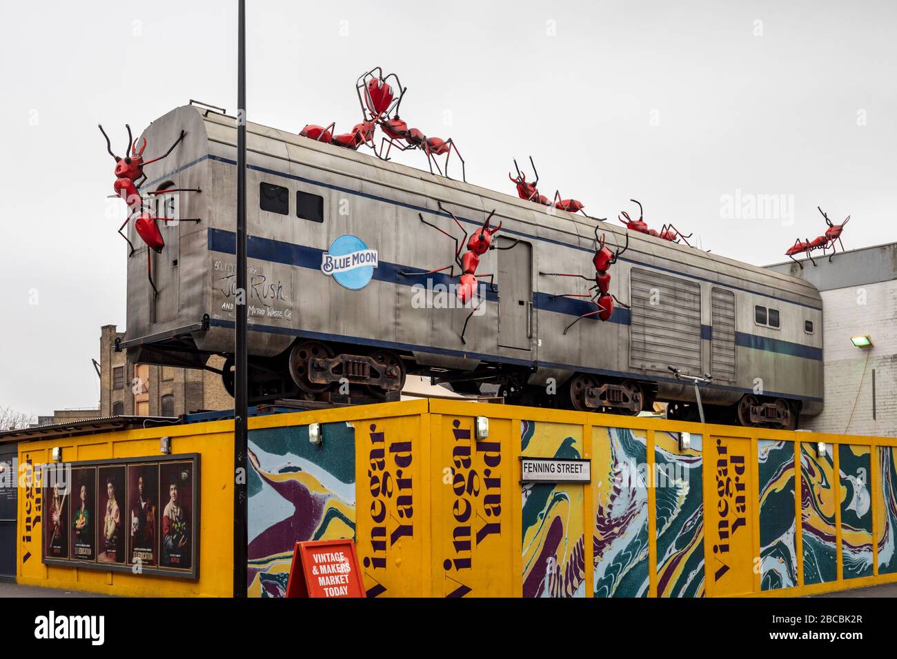 Train carriage and giant red ants installation by Joe Rush, Vinegar Yard, St Thomas Street, Bermondsey, London Stock Photo