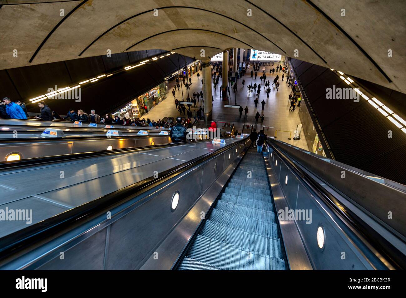 Descending on one of the escalators of Canary Wharf tube station on The Jubilee Line, London, England Stock Photo