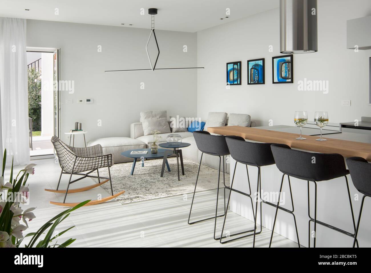 Open space modern interior with living room and a kitchen detail Stock  Photo - Alamy