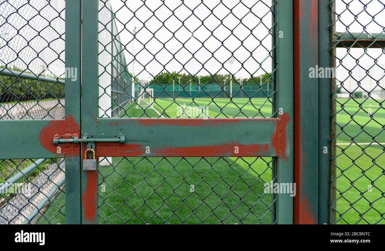 a soccer field behind the fence Stock Photo Alamy