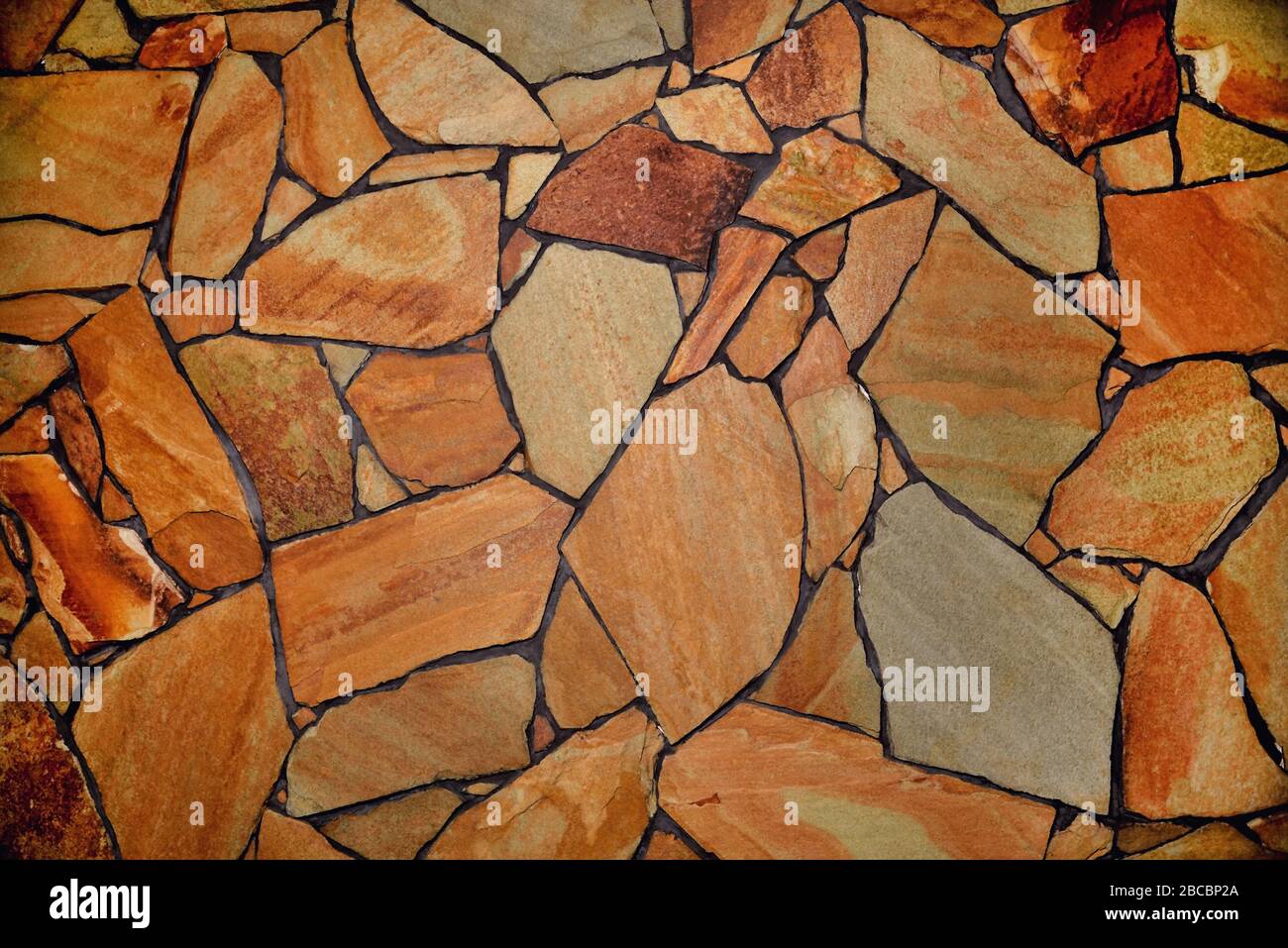 Stone-lined heterogeneous background, textured surface Stock Photo