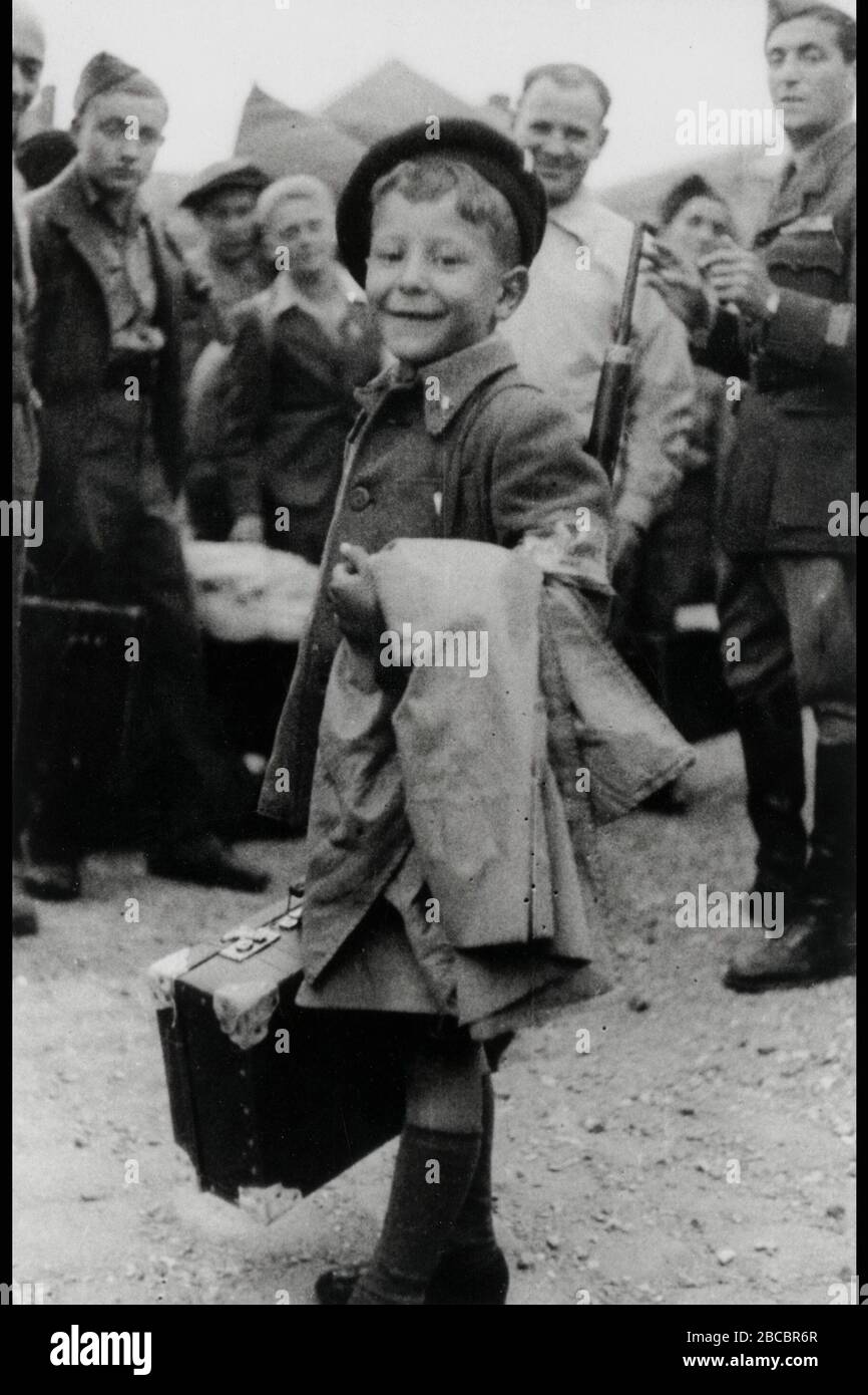 English 8 Year Old Israel Meir Lau Leaving The Buchenwald Nazi Concentration Camp After Its Liberation In The Background His Brother Naftali Lavie O C E U U E O U E I E U I 8 U U N I I I I E O I I I