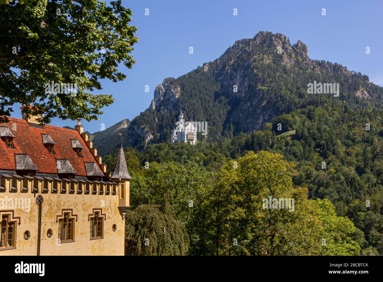 Beautiful view of world-famous Neuschwanstein Castle, the nineteenth-century Romanesque Revival palace built for King Ludwig II on a rugged cliff near Stock Photo