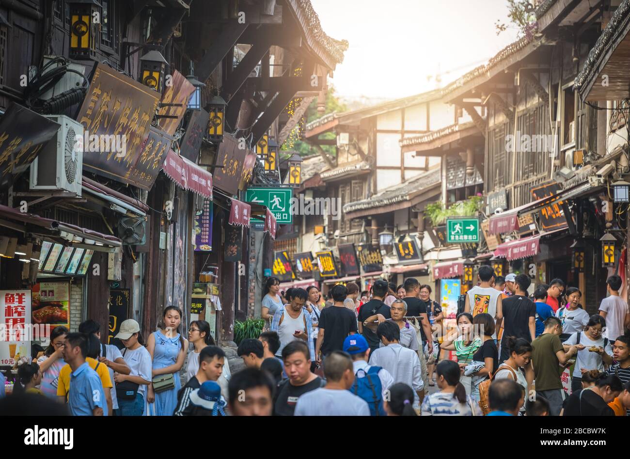 Chongqing, China -  August 2019 : Crowds visiting the popular shopping street in Ci Qi Kou Ancient town Stock Photo