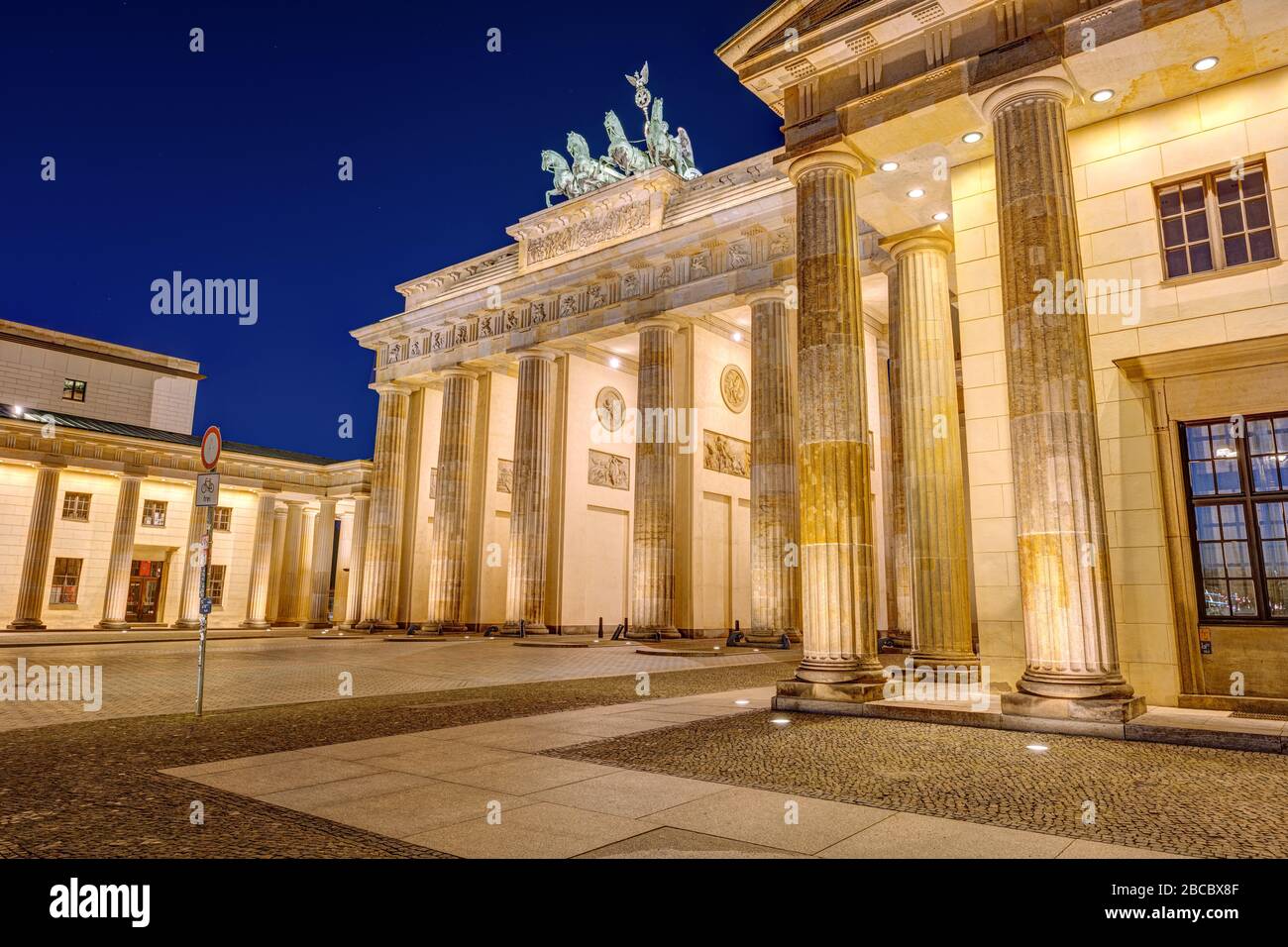 Lateral view of the illuminated Brandenburger Tor in Berlin at night Stock Photo