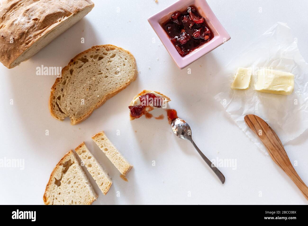 Bread, jam and butter on marble background Stock Photo Alamy
