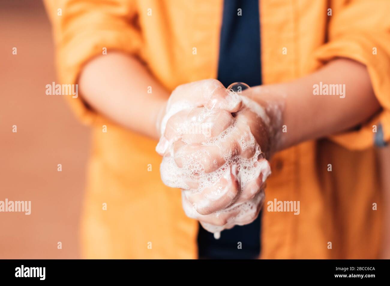 Child washing his hands with soap, close-up, faceless. Virus protection Stock Photo
