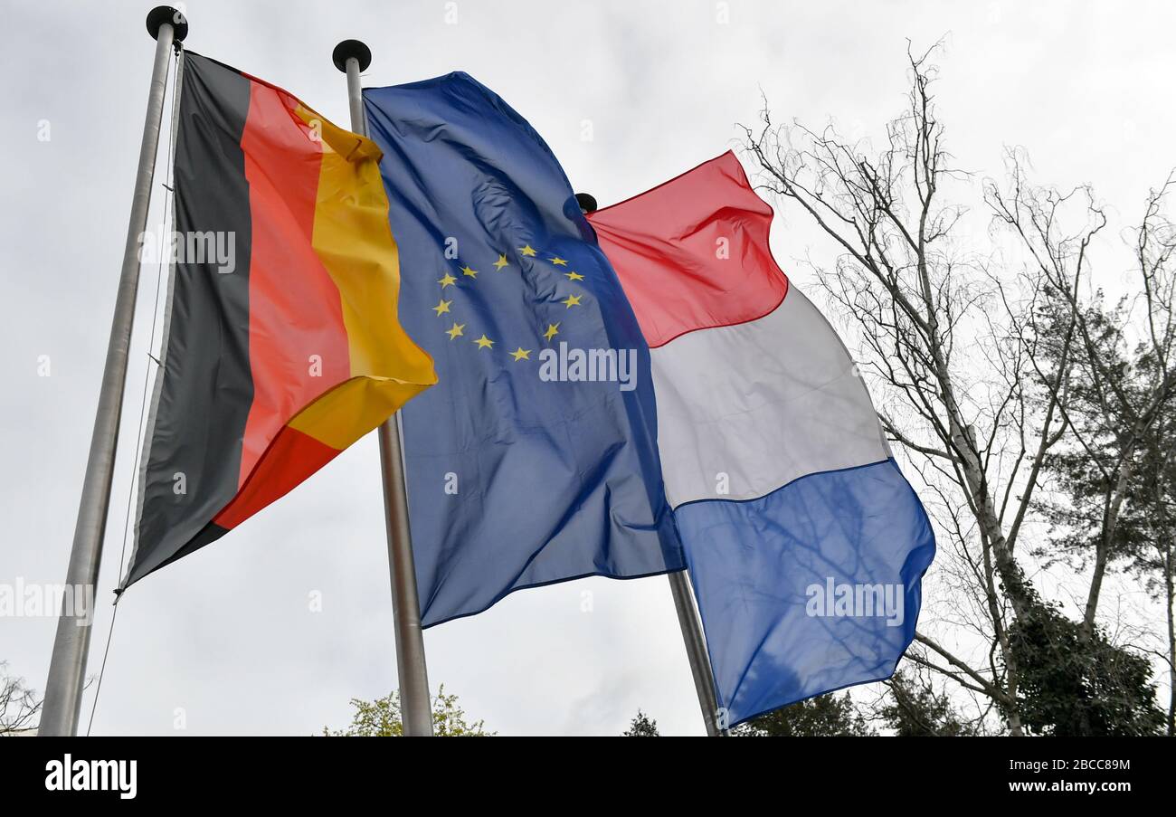 Berlin, Germany. 02nd Apr, 2020. The flags of Germany, the EU and France fly at the Centre Francais de Berlin, a Franco-German cultural centre in Müllerstraße in Wedding. Credit: Jens Kalaene/dpa-Zentralbild/ZB/dpa/Alamy Live News Stock Photo