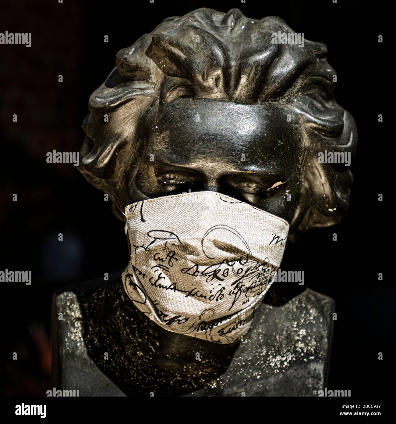 Bust of Ludwig van Beethoven wearing a protective mask Stock Photo