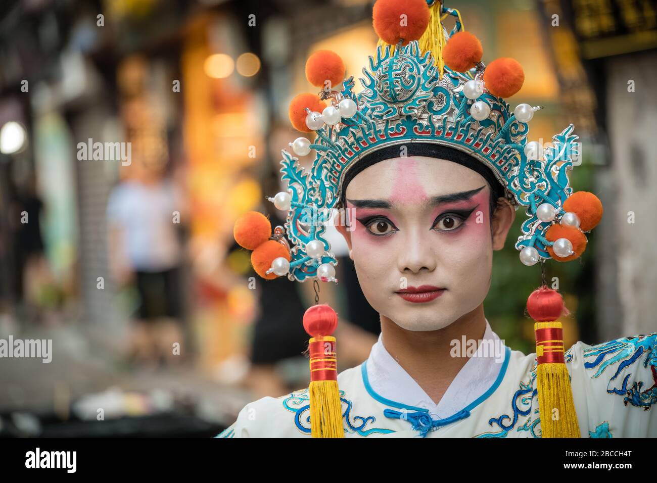 Chongqing, China - August 2019 : Performing during festival chinese person wearing make up and traditional dress, Ci Qi Kou Ancient town, Chongqing Stock Photo
