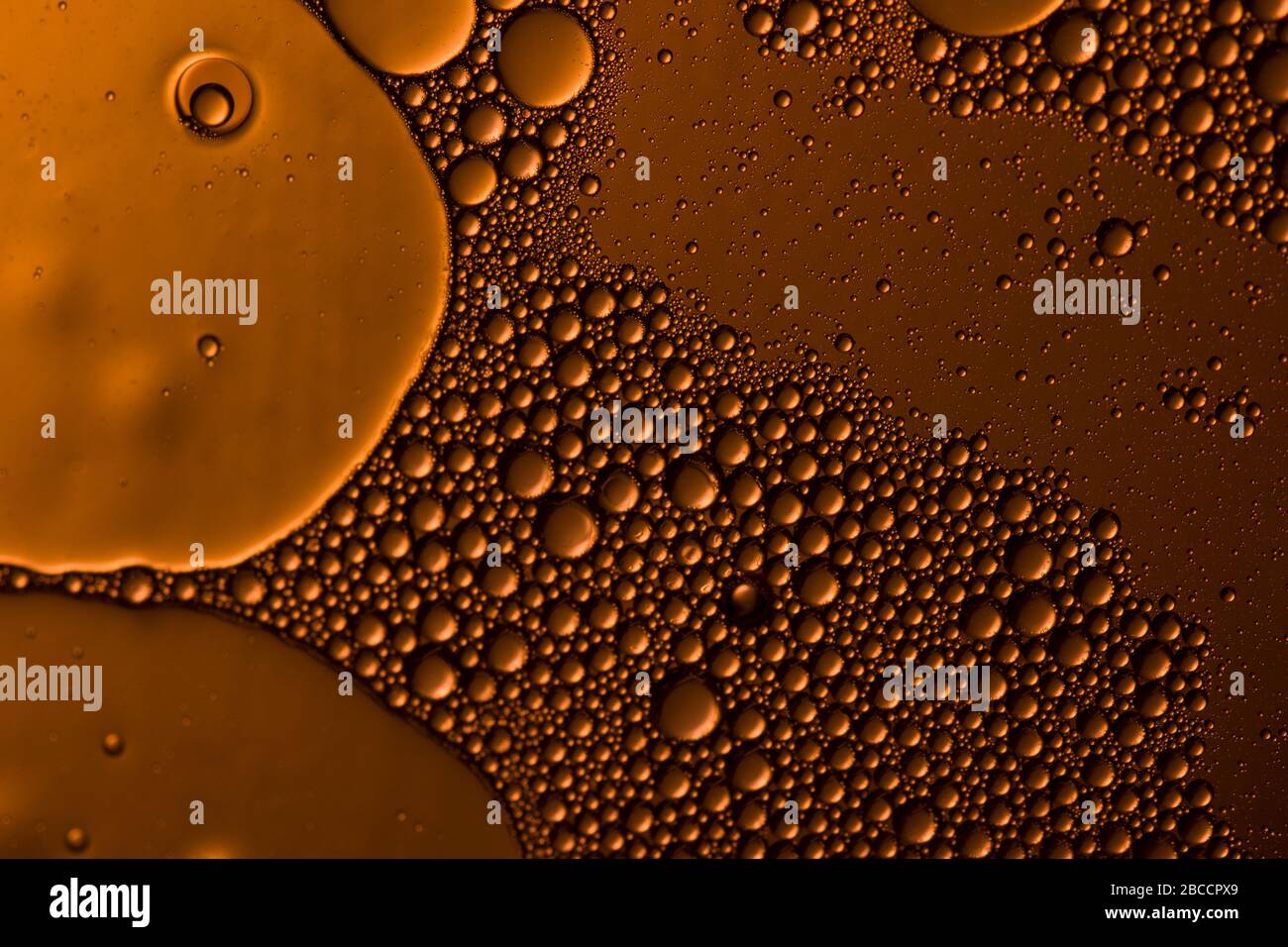 Yellow orange water drops background. Soft focus , close up view Stock