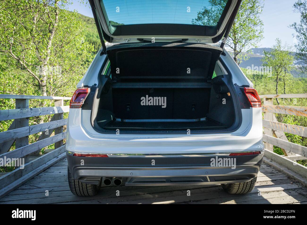 VW Tiguan parked on bridge with open boot Stock Photo