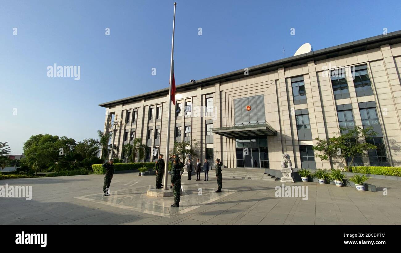 (200404) -- ABIDJAN, April 4, 2020 (Xinhua) -- A Chinese national flag flies at half-mast to mourn for martyrs who died in the fight against the novel coronavirus disease (COVID-19) outbreak and compatriots who died of the disease at the Chinese Embassy to Cote d'Ivoire in Abidjan, Cote d'Ivoire, April 4, 2020. (Chinese Embassy to Cote d'Ivoire/Handout via Xinhua) Stock Photo