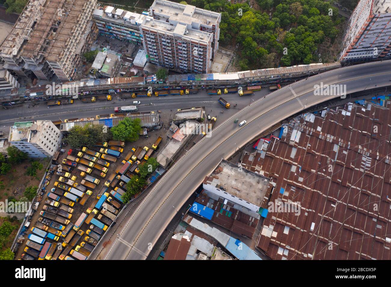 DHAKA, BANGLADESH - APRIL 04: Trucks are parked in the terminal in Dhaka city during government-imposed lockdown as a preventive measure against the C Stock Photo