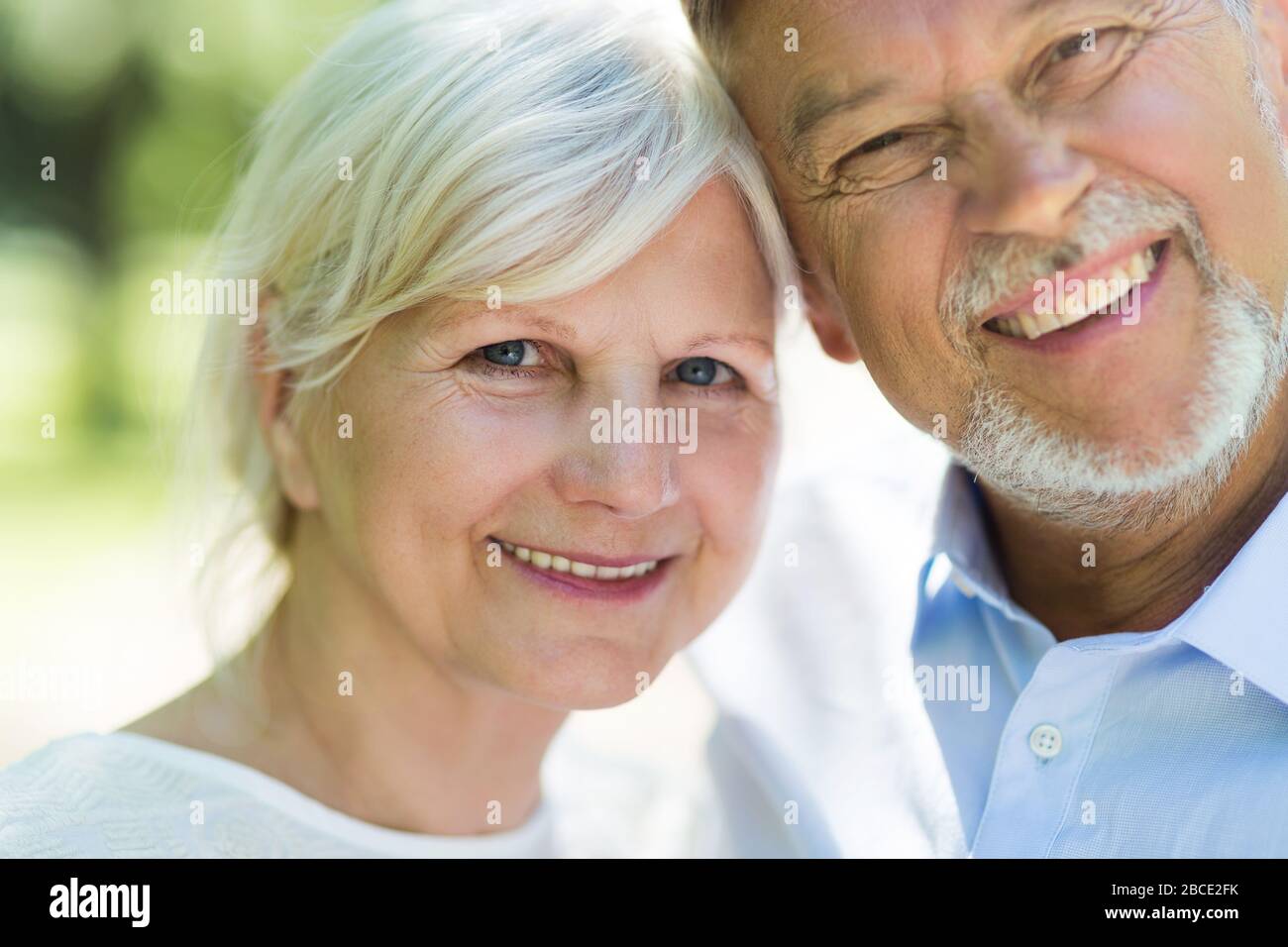 Senior Couple Sitting Park Stock Photo