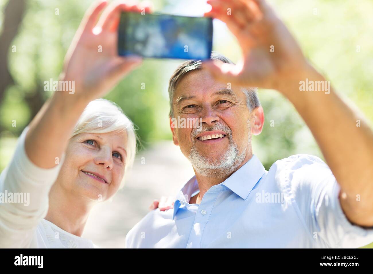 Senior Couple Sitting Park Stock Photo