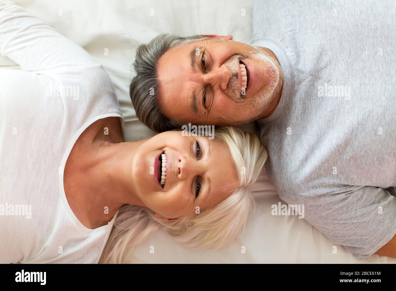 Senior couple in bed together Stock Photo