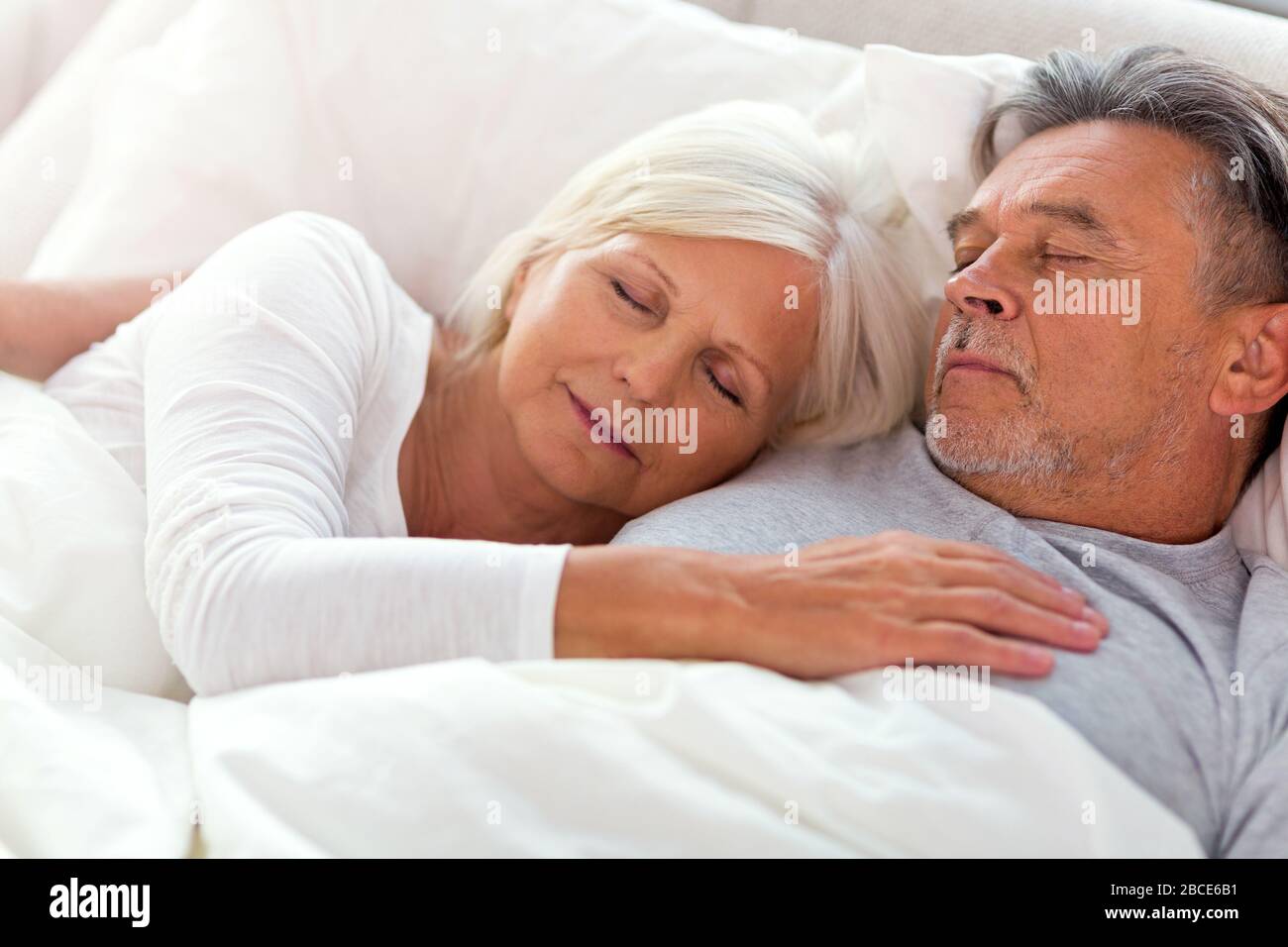 Senior couple in bed together Stock Photo