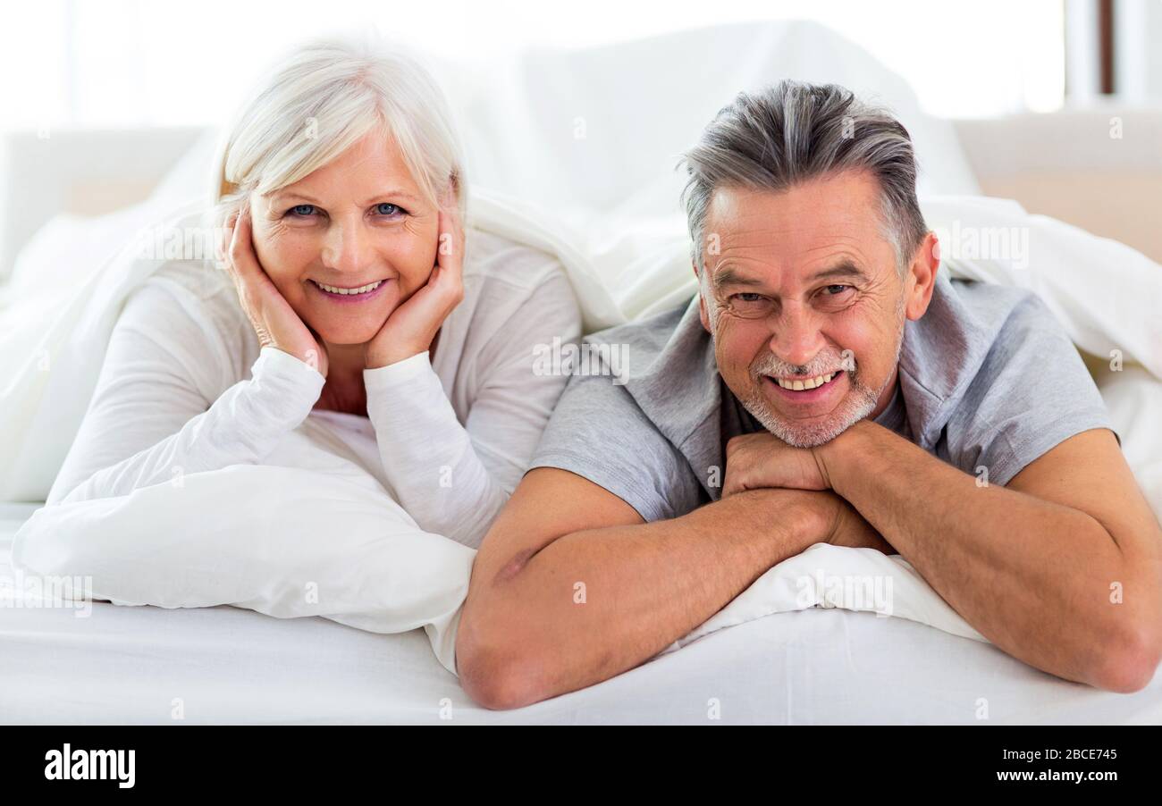 Senior couple in bed together Stock Photo