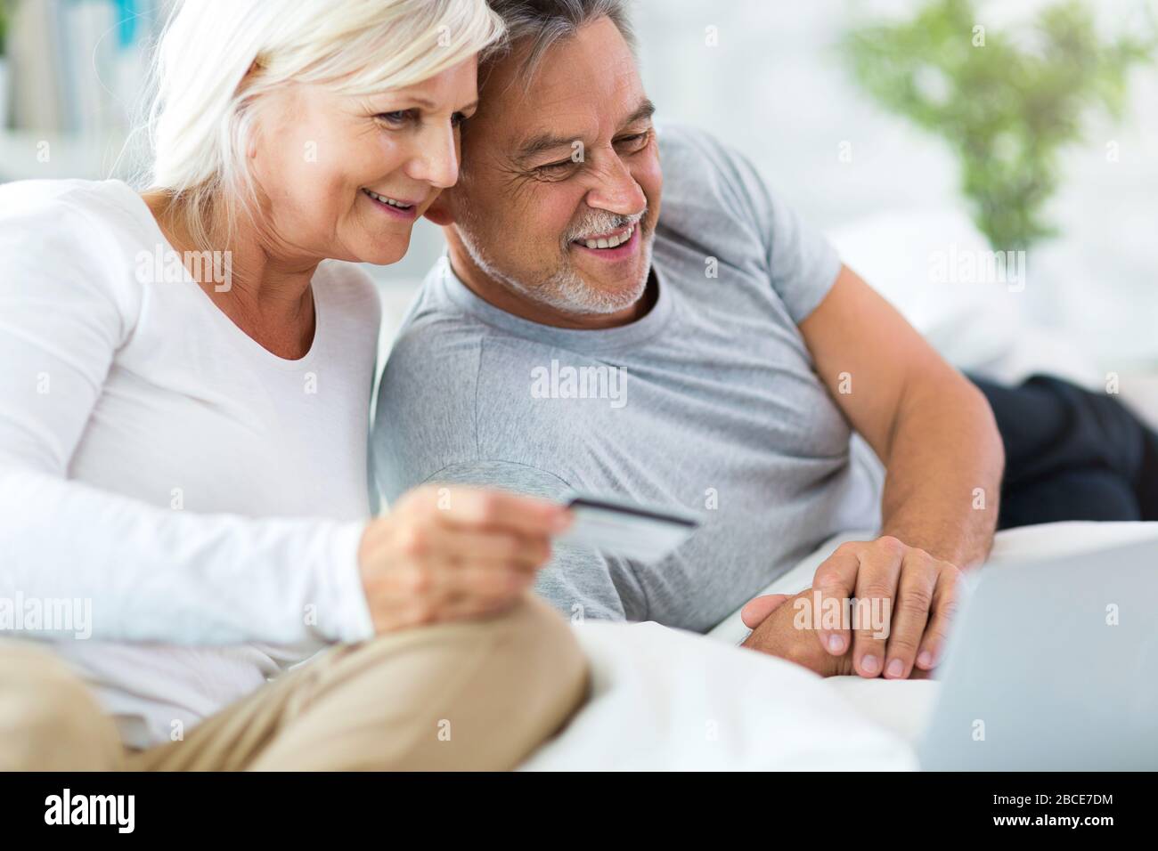 Senior couple using laptop Stock Photo