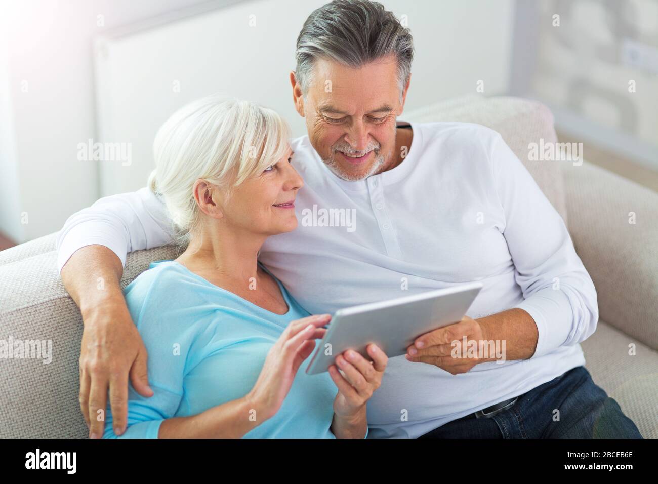 Senior couple using laptop Stock Photo