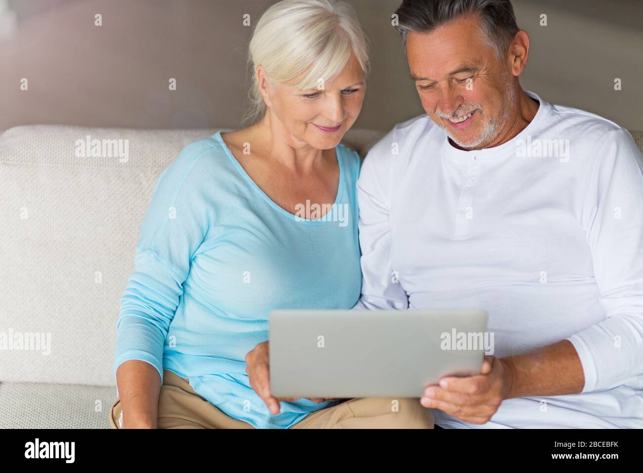 Senior couple using laptop Stock Photo