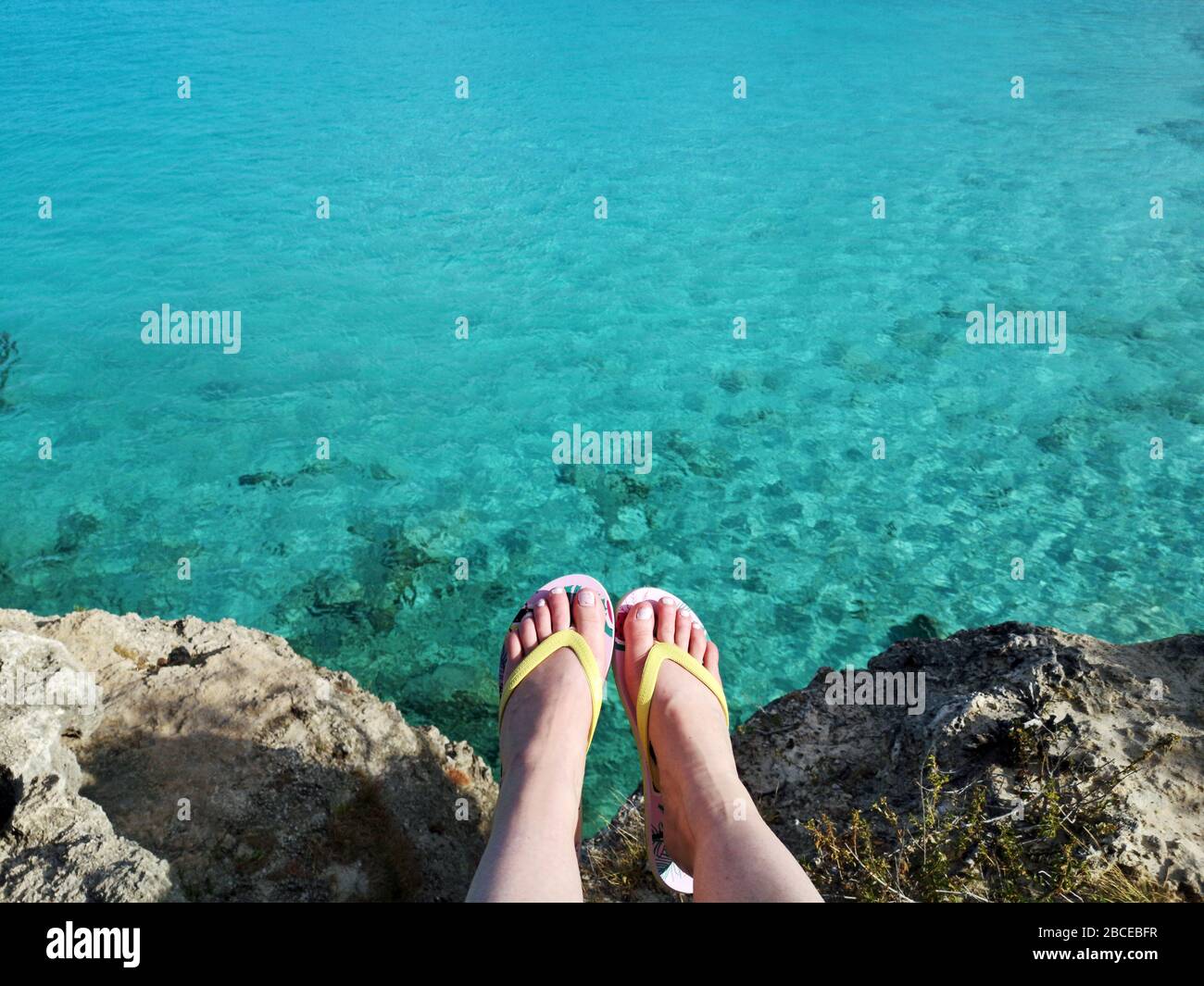 Flip flops and sea on Curacao travel Stock Photo - Alamy