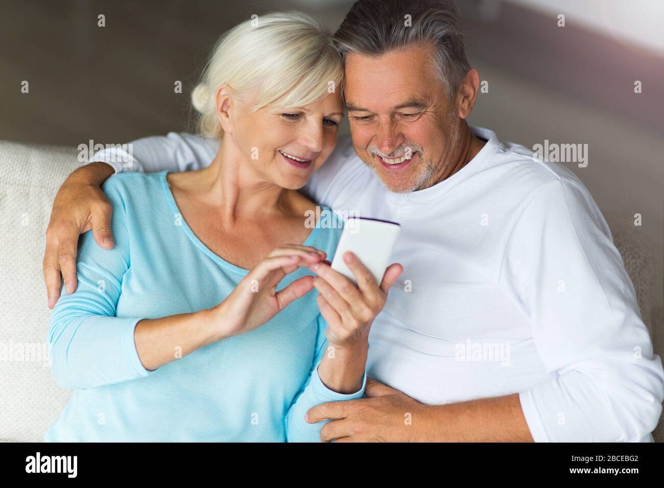Senior couple using mobile phone Stock Photo