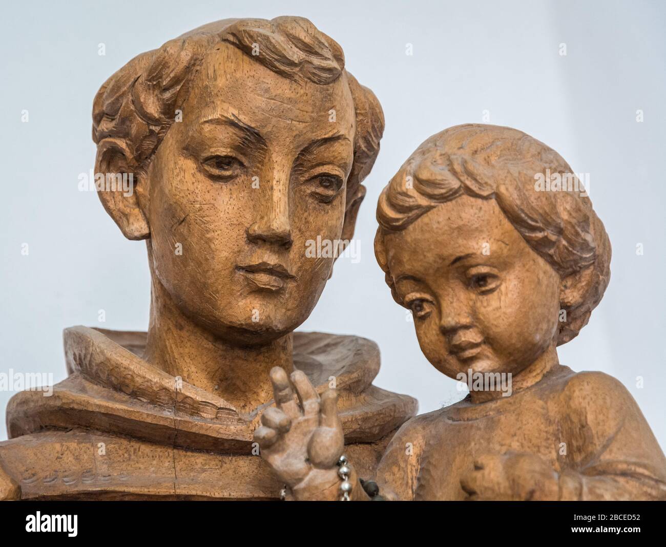 Sanctuary of San Romedio. statue of San Romedio with child inside the Sanctuary. Non Valley,  Trentino Alto Adige, northern Italy, Stock Photo