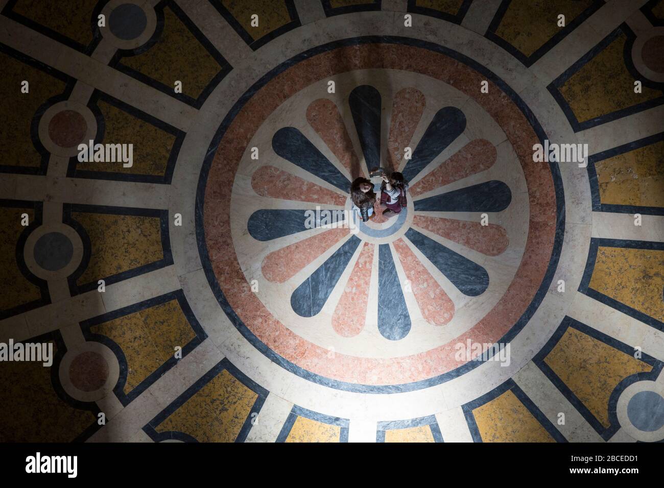 High-angle view of two women standing on the decorated floor of the National Pantheon (formerly the Church of Santa Engrácia), Lisbon Stock Photo