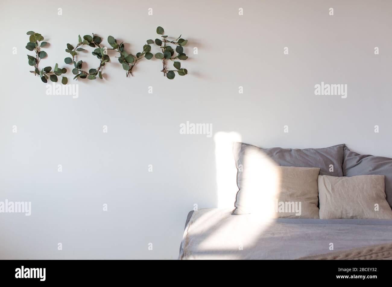 Modern interior design concept. Minimal Nordic Scandinavian style living room sofa with pillows Stock Photo