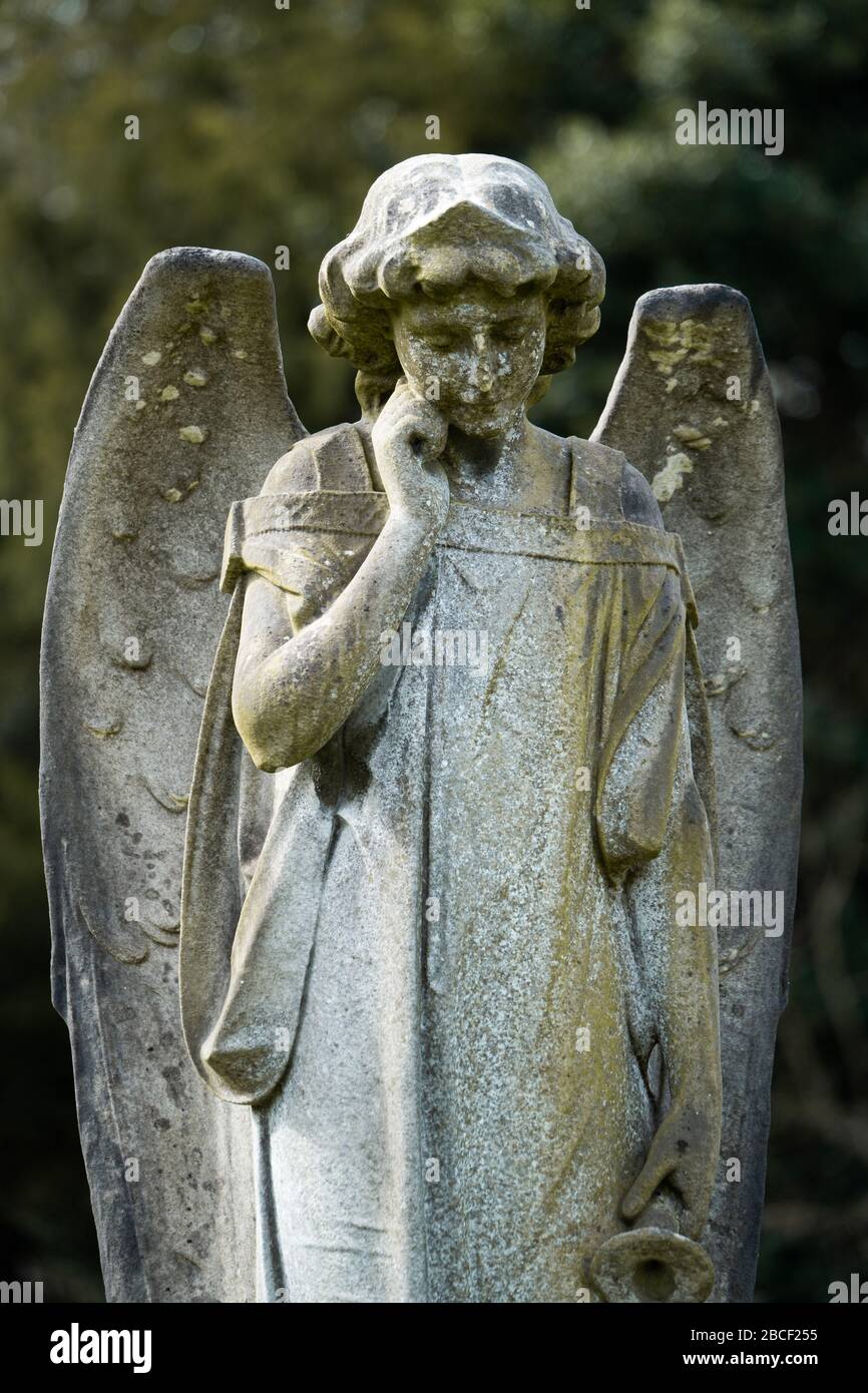 A Christian angel gravestone in a graveyard, UK Stock Photo - Alamy