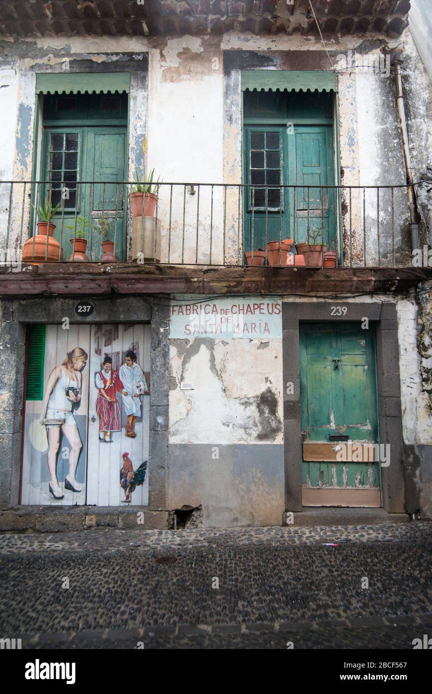 street and wall art at the old houses in the old town of zona Velha in