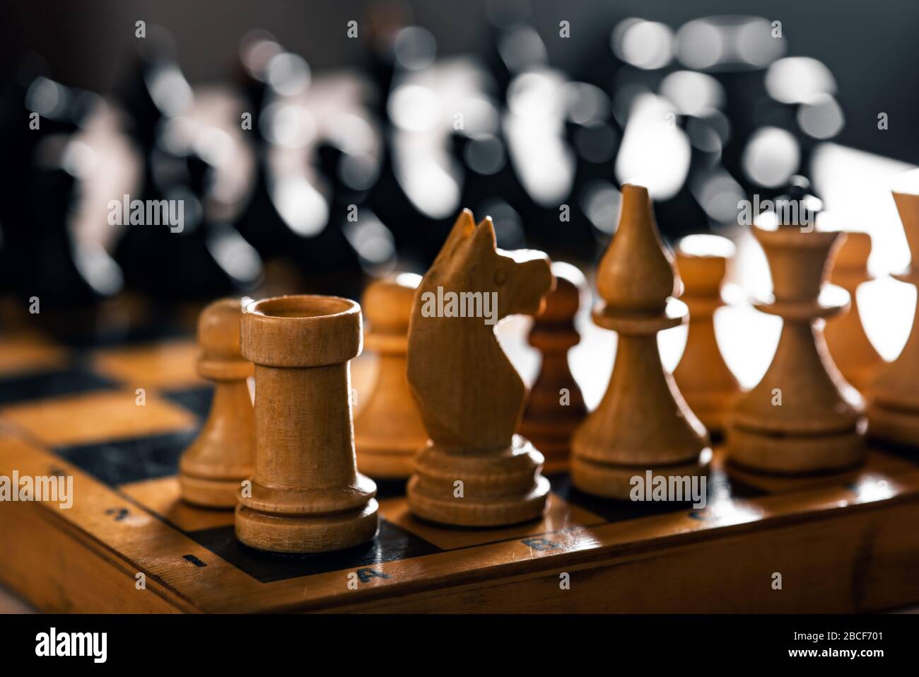 Ancient wooden chess pieces on an old chessboard Stock Photo - Alamy