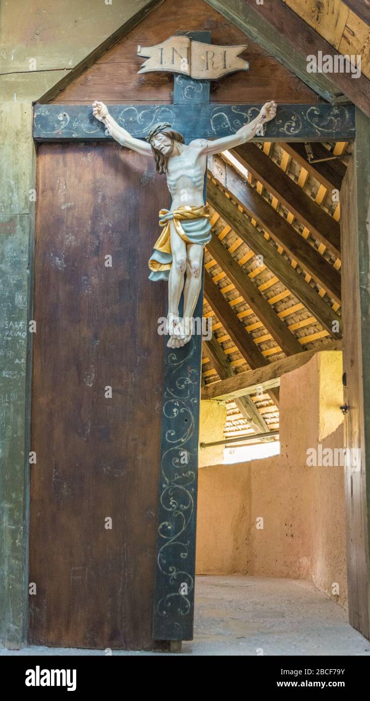 Christ on the cross - wooden crucifix, Sanctuary of San Romedio, Non Valley - Trento province, Trentino Alto Adige, northern Italy Stock Photo