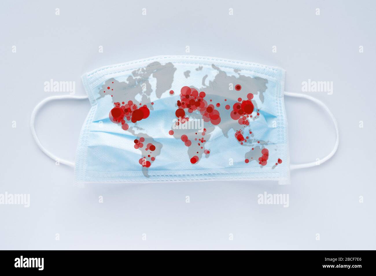 World map showing coronavirus infected countries on face mask Stock Photo