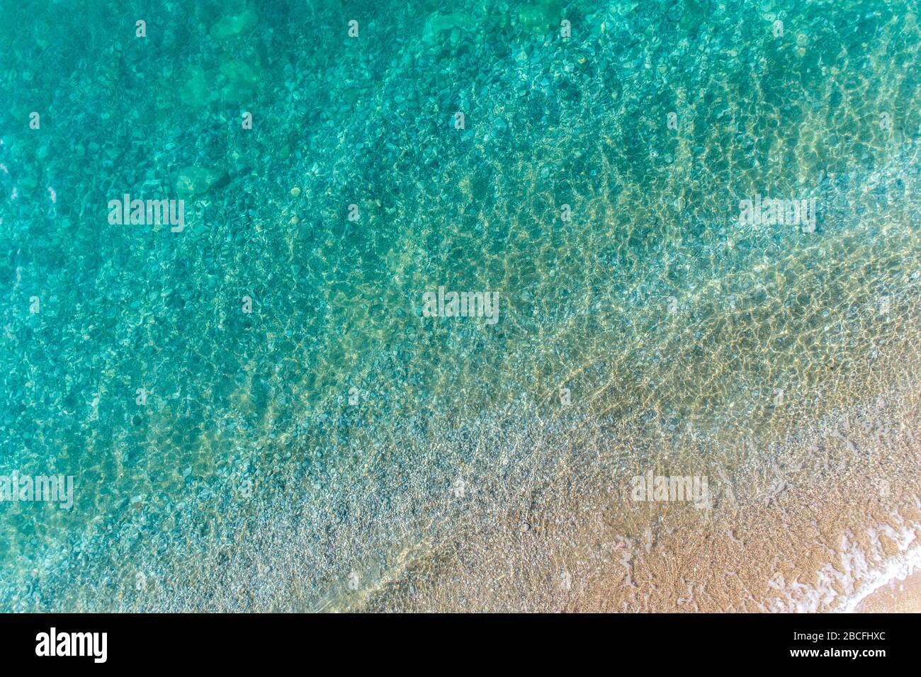 Transparent waves roll on sandy hi-res stock photography and images - Alamy