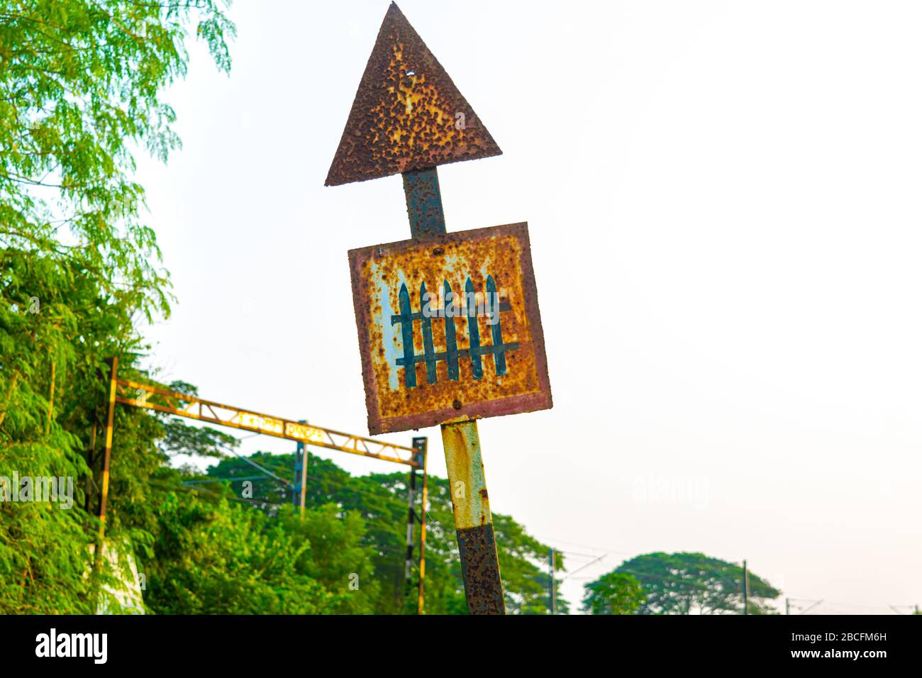 Old Rusty Railway Level Crossing Signal Or Sign With Sky And Green Tree And Bushes On Background Stock Photo Alamy Old Rusty Railway Level Crossing Signal Or Sign With Sky And Green Tree And Bushes On Background Stock Photo Alamy