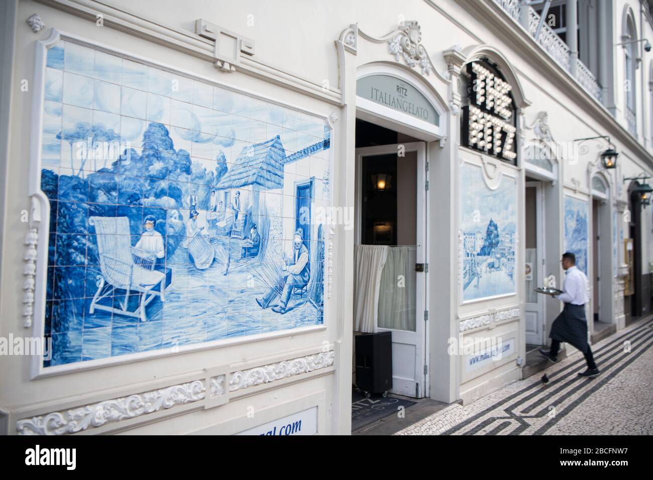 the handmade tiles or azulejo on the wall of the cafe Ritz in the city centre of Funchal on the Island Madeira of Portugal.   Portugal, Madeira, April Stock Photo