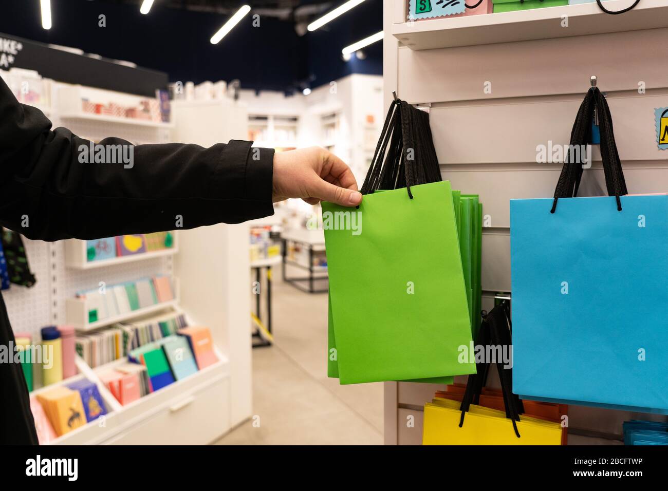 Take packages for purchases. Colorful bags in the trading floor. Close-up Stock Photo