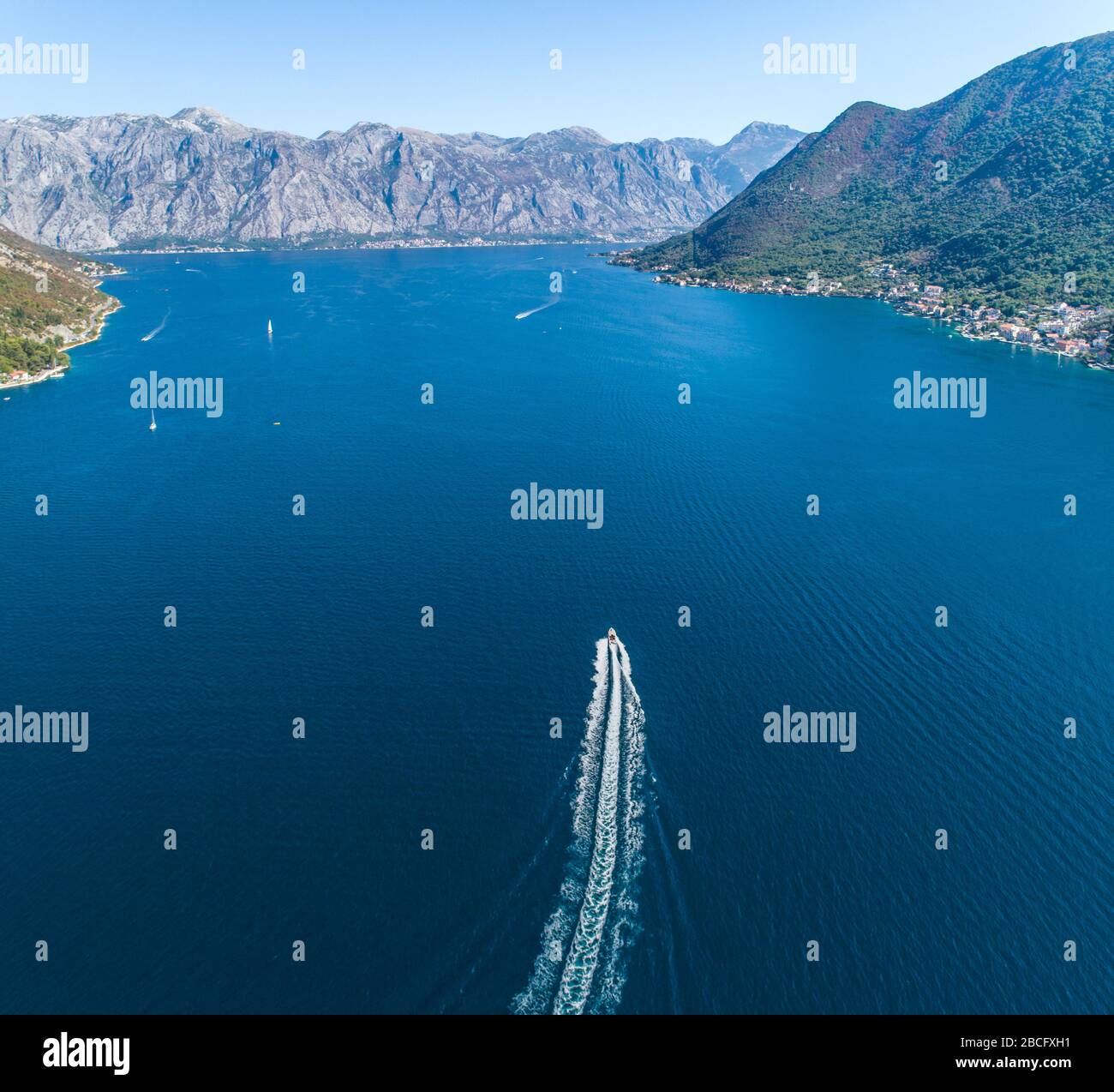 Aerial view of a boat walking and leaving a mark on the water Stock ...